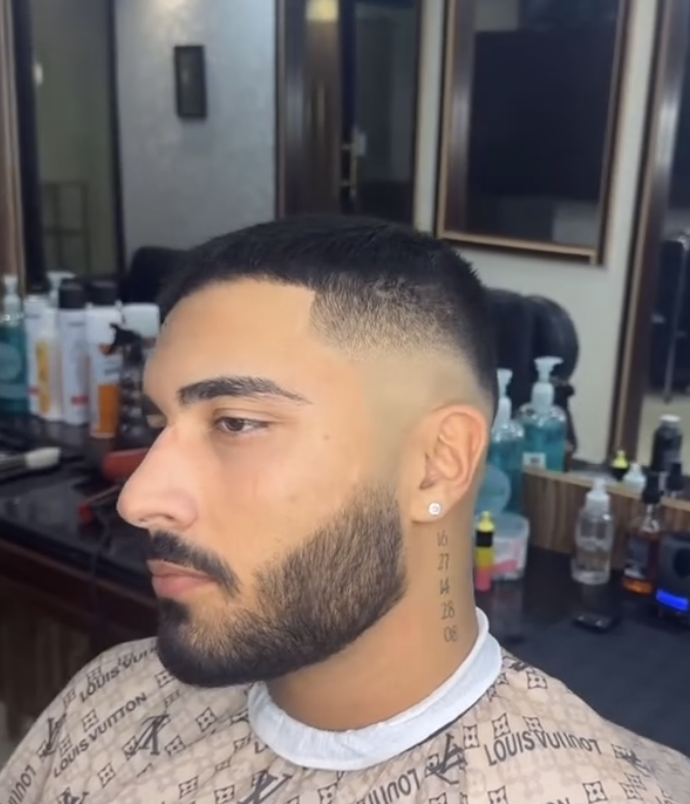 RK Salon client with a clean fade and beard lineup